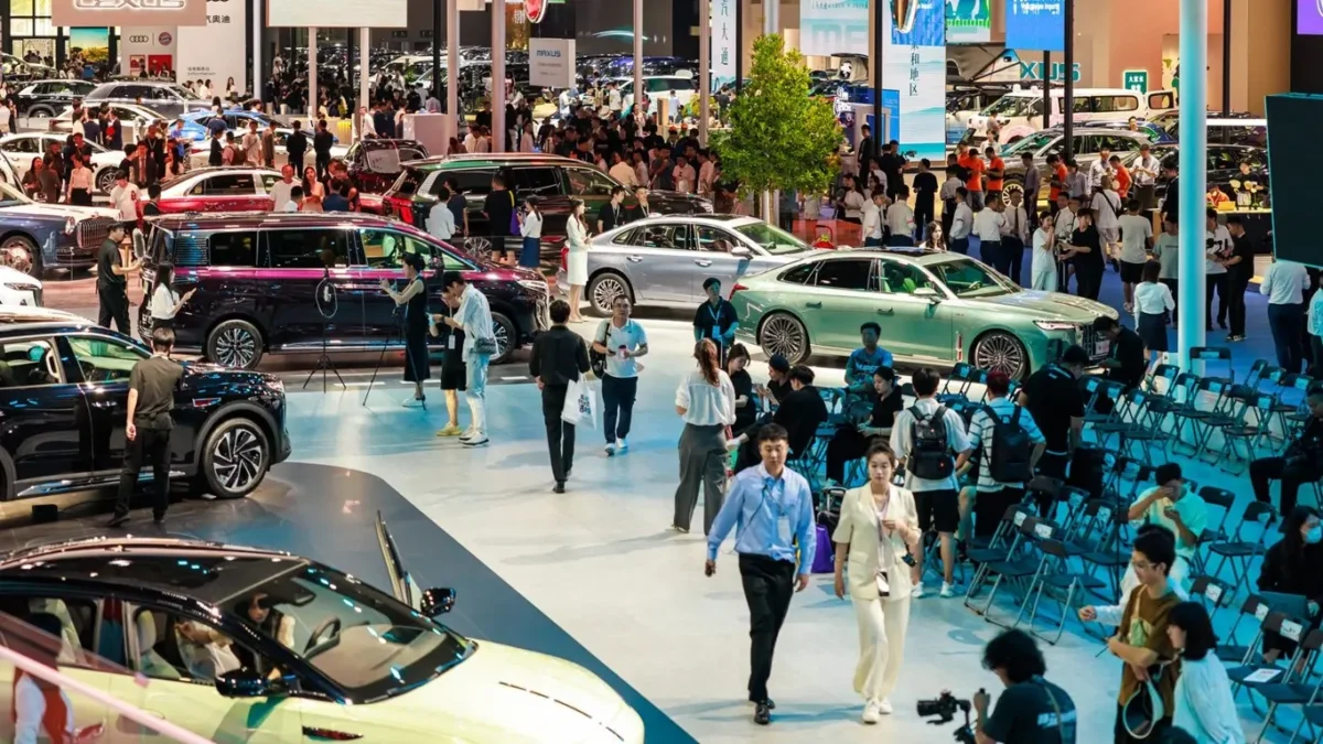 The main exhibition hall of the 2026 Beijing Auto Show filled with electric vehicle displays from Chinese and international automakers across a record 380,000 square metre venue.