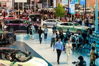 The main exhibition hall of the 2026 Beijing Auto Show filled with electric vehicle displays from Chinese and international automakers across a record 380,000 square metre venue.
