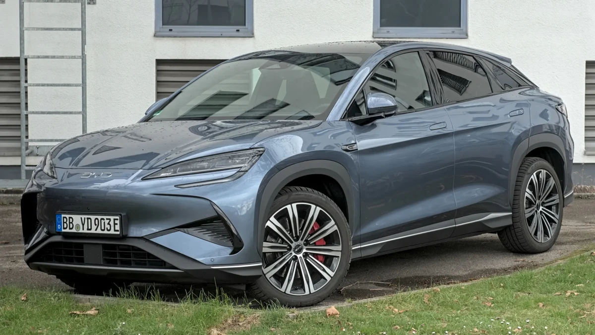 A BYD Sealion electric SUV on a busy urban street representing the Chinese automaker's record overseas sales surge driven by rising global oil prices in 2026.