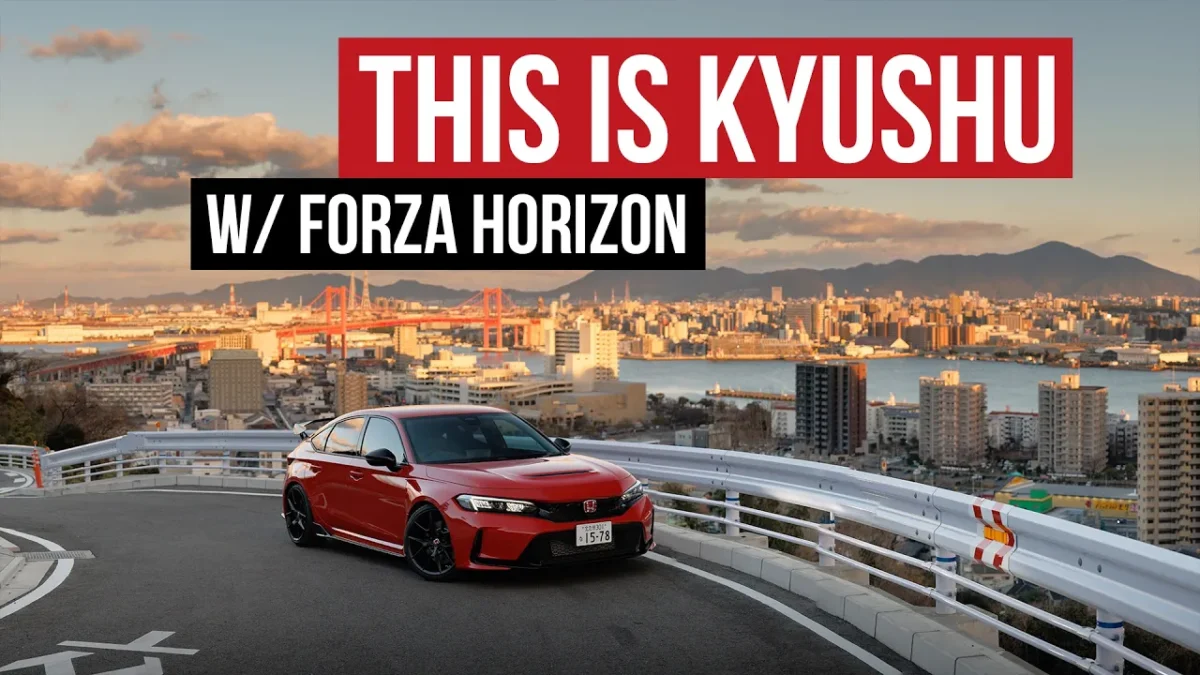 A red Honda Civic Type R FL5 parked on a scenic overlook in Kitakyushu, Japan, with the Wakato Bridge and the city's harbour skyline stretching across the golden-hour horizon behind it, shot during a Forza Horizon collaboration.