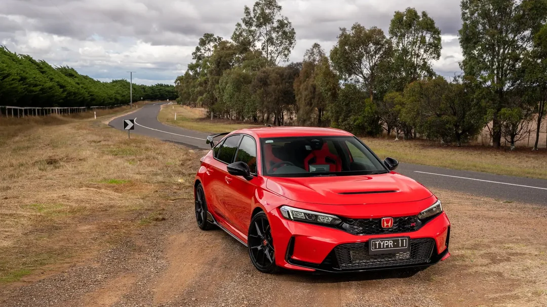 A red Honda Civic Type R FL5 on a mountain road in Japan, during a photography shoot for Forza Horizon 6.