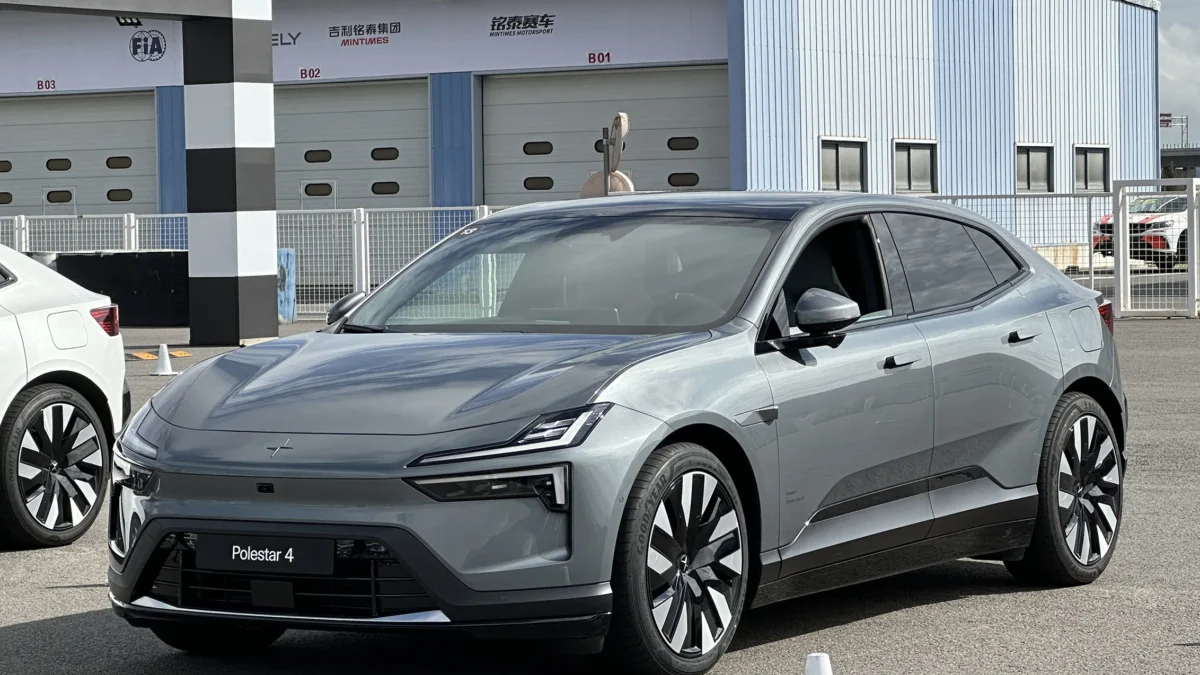 The 2026 Polestar 4 electric SUV-coupe parked in natural light showing its sloping roofline and blank rear panel where a conventional rear window would normally appear.