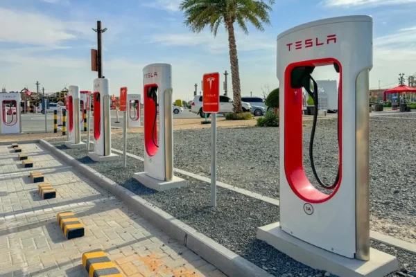 A Tesla Supercharger station at a commercial centre in Dubai, UAE, representing the company's expanding Gulf infrastructure now under threat from Iran's IRGC.