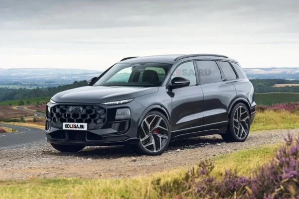 A 2027 Audi Q9 full-size luxury SUV photographed with its Digital Matrix LED headlights illuminated.