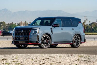 The 2026 Nissan Armada Nismo in Stealth Gray with Nismo-exclusive front fascia, 22-inch forged wheels, and roofline spoiler, representing Nissan's first performance-branded full-size SUV.