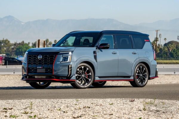 The 2026 Nissan Armada Nismo in Stealth Gray with Nismo-exclusive front fascia, 22-inch forged wheels, and roofline spoiler, representing Nissan's first performance-branded full-size SUV.