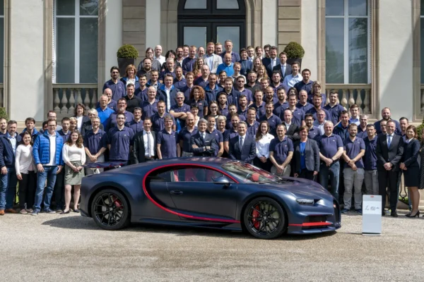 A Bugatti Chiron parked outside the brand's Molsheim factory in France, representing Porsche's divestment of its Bugatti Rimac stake to a private equity consortium.