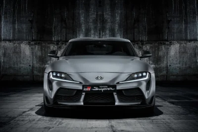The 2019 Toyota GR Supra A90 in red, co-developed with BMW on the same platform as the Z4, marking the Supra's return after a 17-year absence