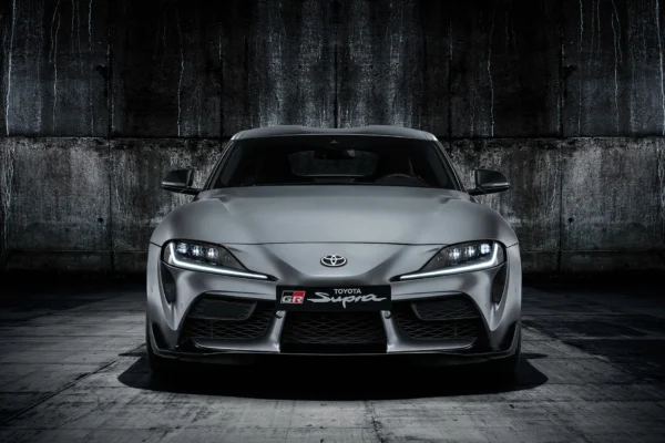 The 2019 Toyota GR Supra A90 in red, co-developed with BMW on the same platform as the Z4, marking the Supra's return after a 17-year absence