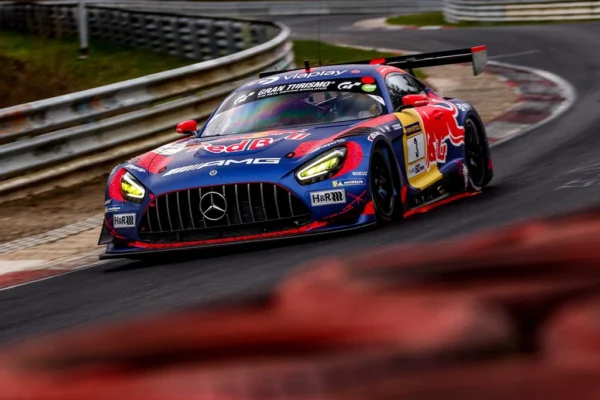 Max Verstappen's Red Bull-liveried #3 Mercedes-AMG GT3 racing through the Nordschleife at the 2026 Nürburgring 24 Hours