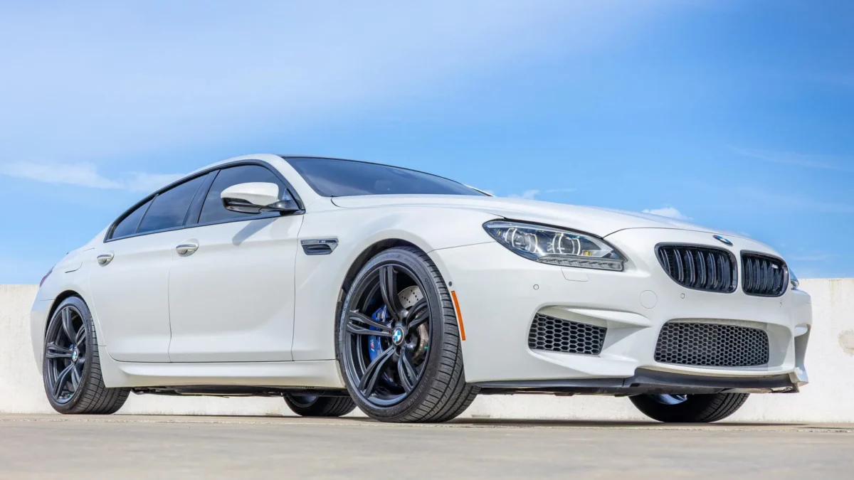 A 2015 BMW M6 Gran Coupe Competition in Space Gray with the rare six-speed manual transmission, one of only 103 manual M6 Gran Coupes ever built, parked on a clean urban street representing the ultimate sleeper enthusiast daily driver.