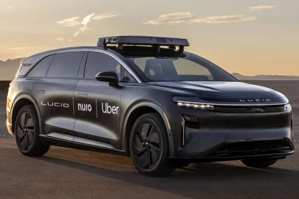 A Lucid Gravity SUV configured as an autonomous robotaxi with roof-mounted sensor halo containing lidar, cameras and radar, representing the Lucid-Nuro-Uber commercial robotaxi programme launching in San Francisco in 2026.